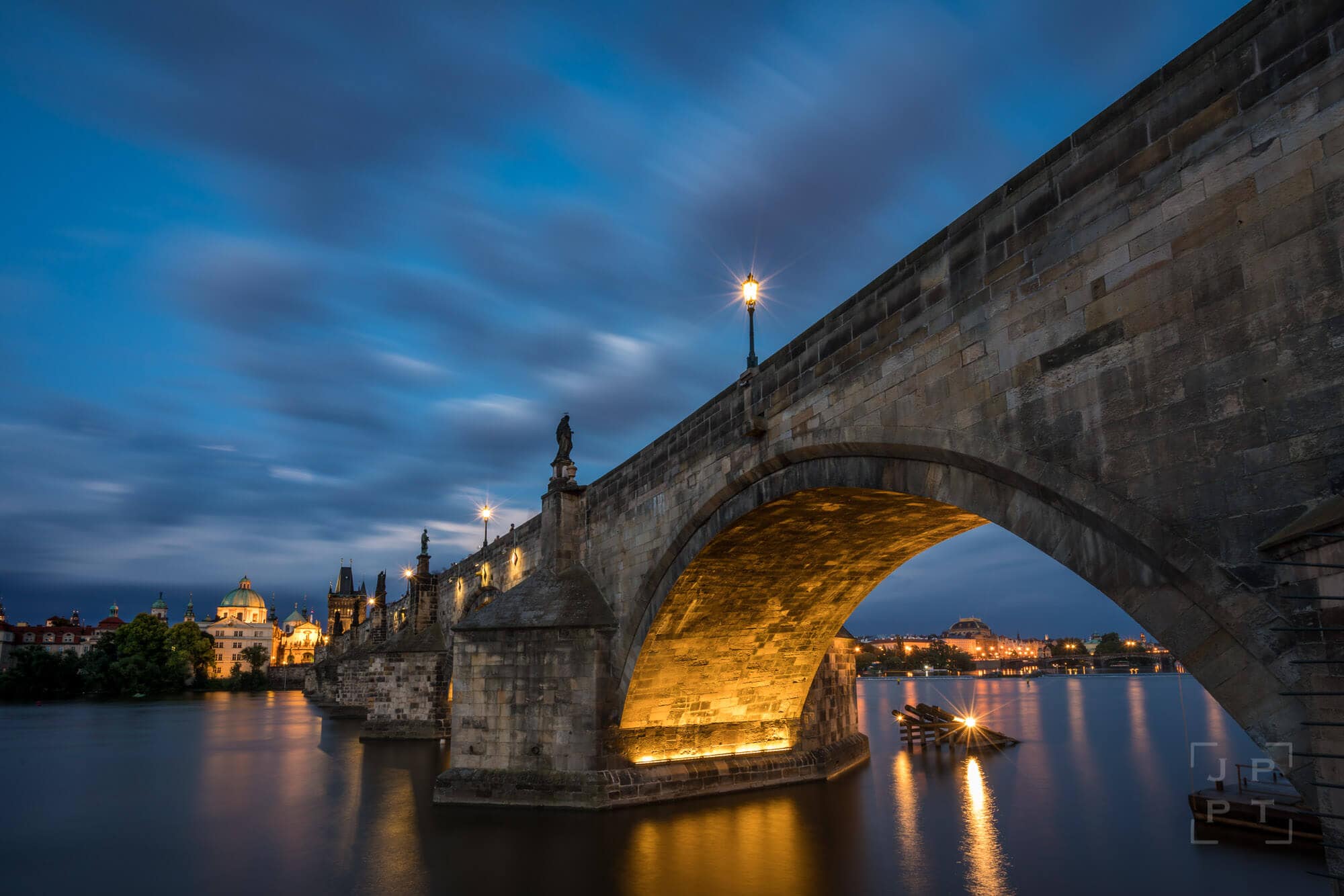 Illuminated arch of Charles bridge, Prague
