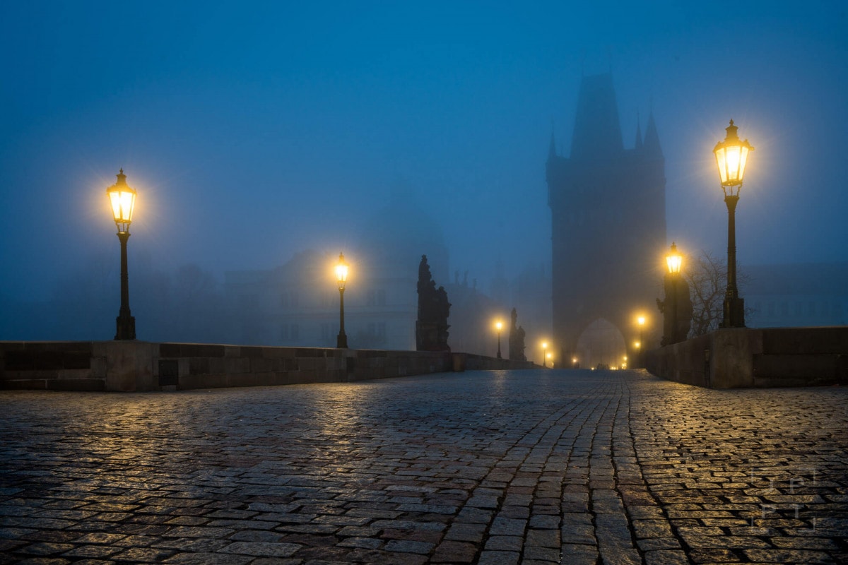 Charles bridge with fog at night, Prague